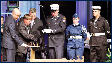Ceremony of US Military giving members of Gander community two steel pieces that were recovered from the World Trade Center